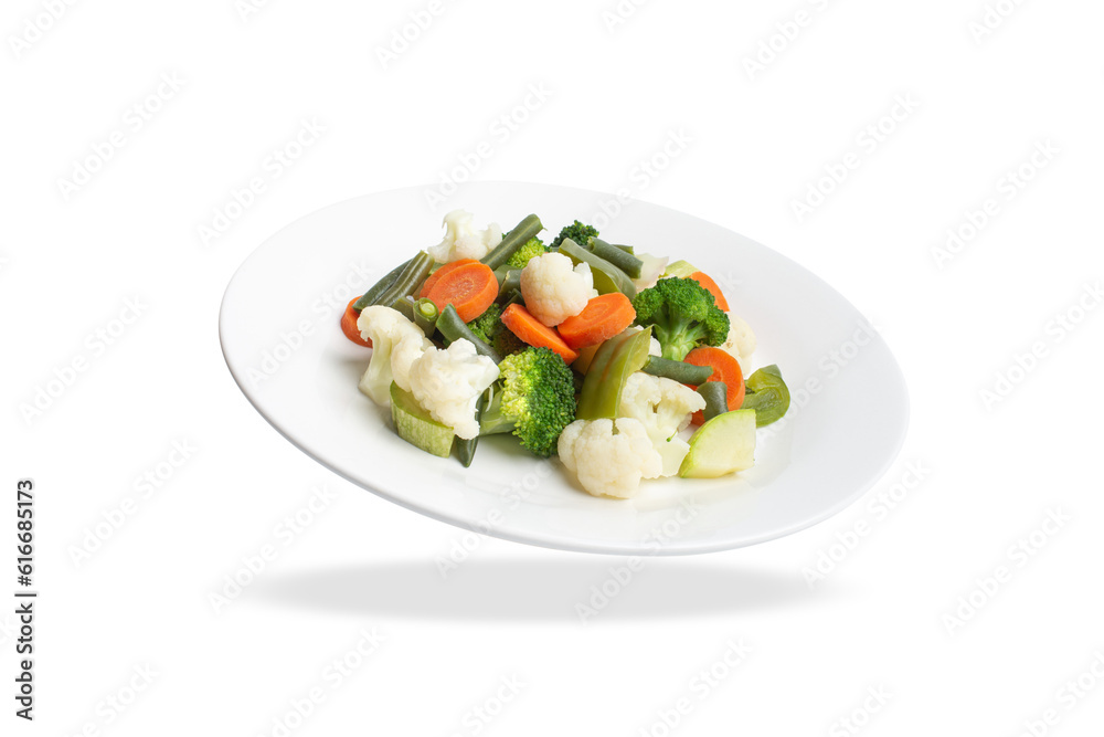 steamed vegetables on a white plate on a white background. steamed vegetables on a white plate on a white background.
