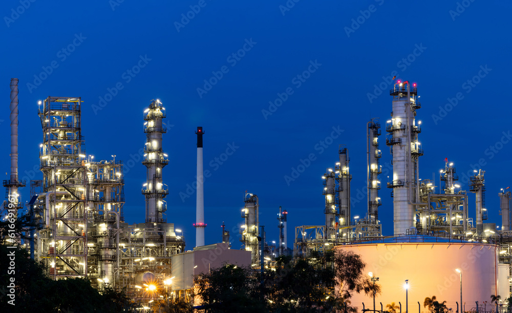 Oil and gas refinery plant firm industry zone at night.Oil and gas Industrial petrochemical fuel power and energy.Chemical Industry.Gas storage tanks and oil storage tank in refinery industrial plant.