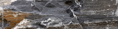 Dark with gold and white inclusions natural stone in Alps 4x1 banner to social network, webdesign