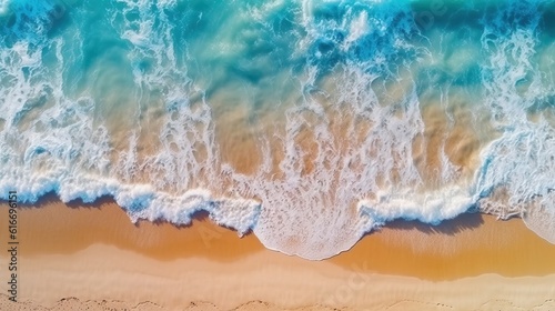 Blue sea sandy beach. Ocean waves on the beach as a background. Beautiful natural summer vacation holidays background. Aerial top down view of beach and sea with blue water waves.