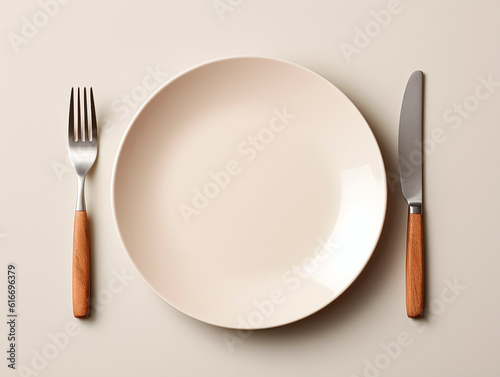 Empty plate, knife and fork on beige background, top view.AI Generated