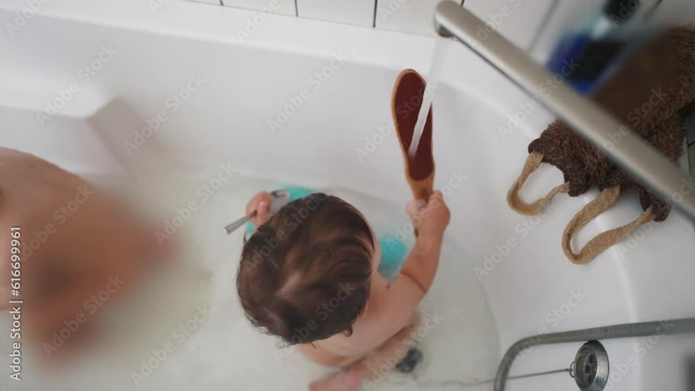 two baby bathe in the bath. happy family kid dream concept. baby wash