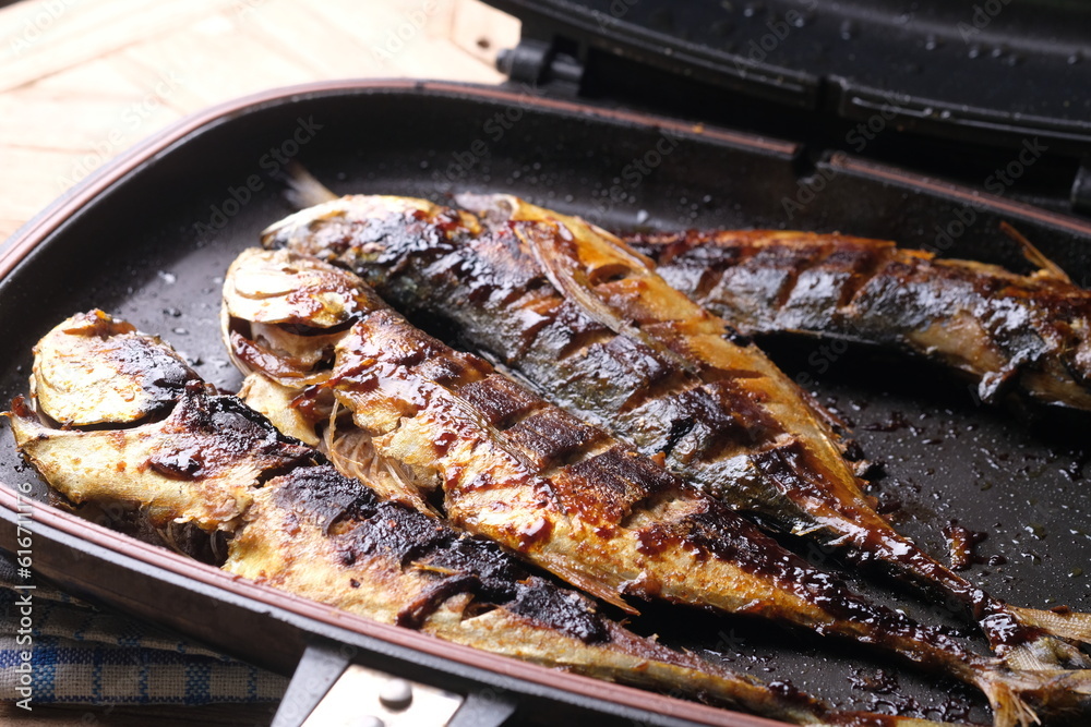 Teflon grilled skipjack. fish baked in a teflon-coated pan. Ikan cakalang bakar. Indonesian food.
Teflon grilled skipjack. fish baked in a teflon-coated pan. Ikan cakalang bakar. Indonesian food.