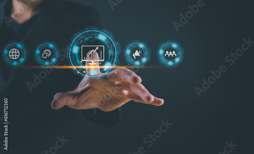 Business hand showing symbols and icons of internet advertising, global digital marketing and quarterly increase sales, business technology concept, online marketing, e-business,ecommerce online