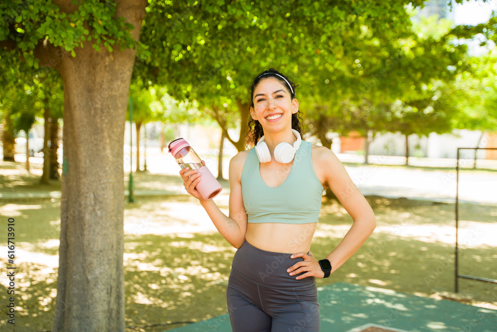 Sporty hispanic woman happy about her workout run Sporty hispanic woman happy about her workout run