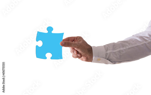 Isolated  businessman holds a piace of puzzle. Concept teamwork, partnership, integration photo