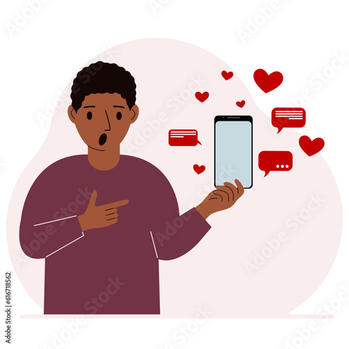 A man with a smartphone in his hand. The concept of correspondence, communication, social networks. Lots of hearts.