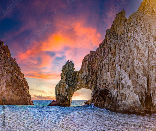 Cape Saint Luke Arch under a beautiful sunset over the Gulf of California that separates the Sea of Cortez from the Pacific Ocean, landscapes of Baja California Sur, Mexico. photo