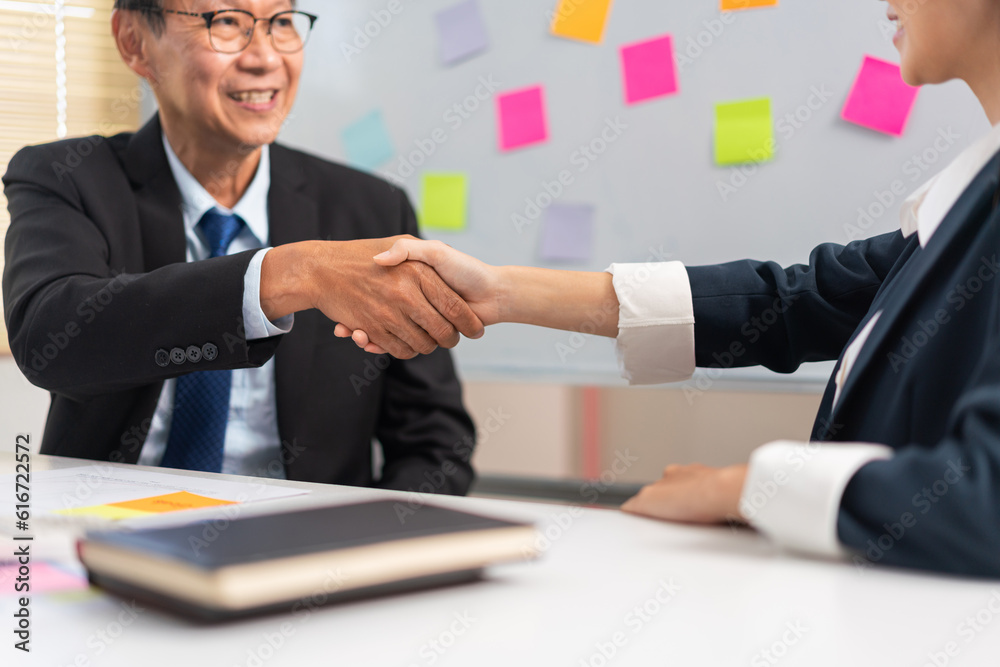 Business partnership concept, Two business people is shaking hand after make agreements together Business partnership concept, Two business people is shaking hand after make agreements together
