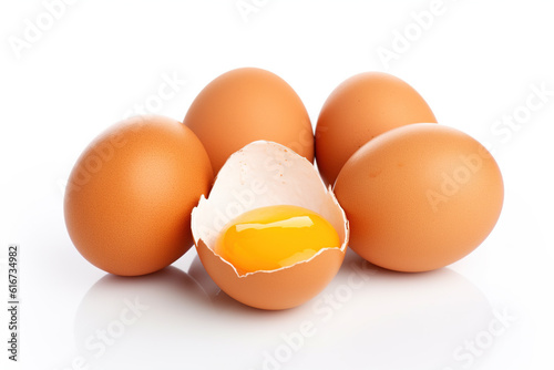 brown eggs with one cracked open isolated on white background, yolk, natural freshness and quality