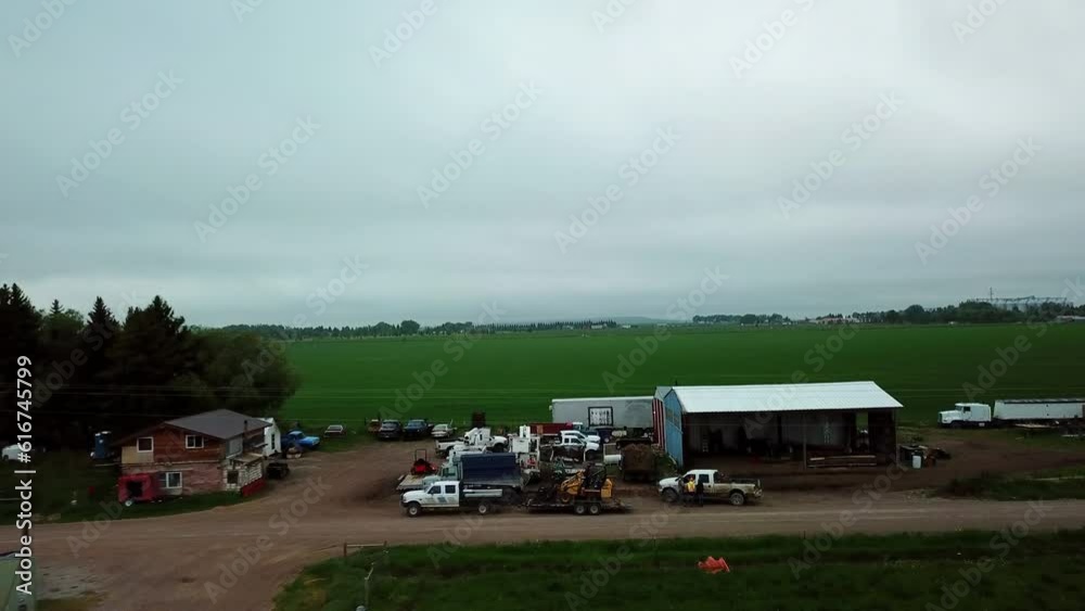 Aerial Shot Of Vehicles And Structures Near Field Against Sky, Drone Flying Forward Over Rural Landscape - Billings, Montana Aerial Shot Of Vehicles And Structures Near Field Against Sky, Drone Flying Forward Over Rural Landscape - Billings, Montana