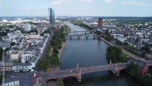 Above a section of the river Main flowing through Frankfurt, where the Floesser bridge, the Ignatz-Bubis bridge, and the old bridge can be seen. photo