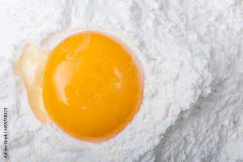egg yolk on flour, full frame