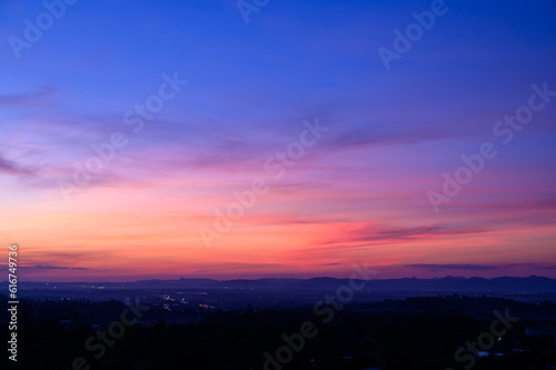 Evening time of panorama mountain under dramatic twilight sky and cloud. Nightfall Silhouette mountain on sunset. © bigy9950