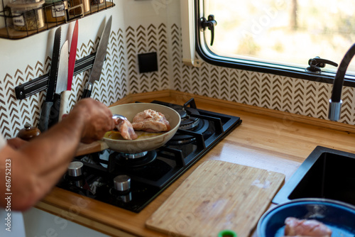 Wallpaper Mural older man cooking in his motorhome,Cooking on Wheels Torontodigital.ca