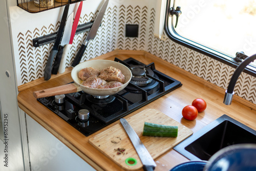 Wallpaper Mural older man cooking in his motorhome,Cooking on the Go Torontodigital.ca