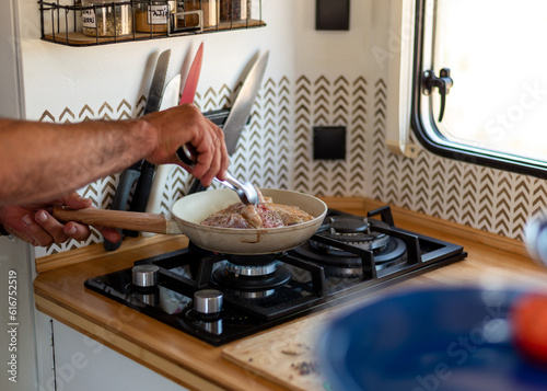 Wallpaper Mural older man cooking in his motorhome,Retired Chef's Haven: Creating Flavorsome Memories on the Road Torontodigital.ca