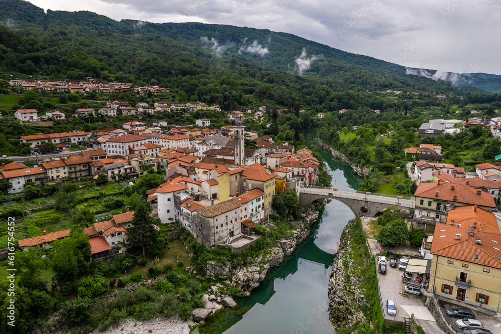 Aerial drone view of Kanal na Soci town in Slovenia and Soca river.