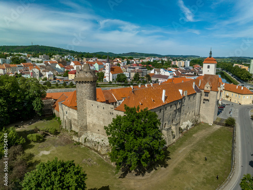 Aerial view of Strakonice castle next to the Otava river in Czechia with Gothic, Baroque palace and restored circular donjon with edge called Rumpal tower photo