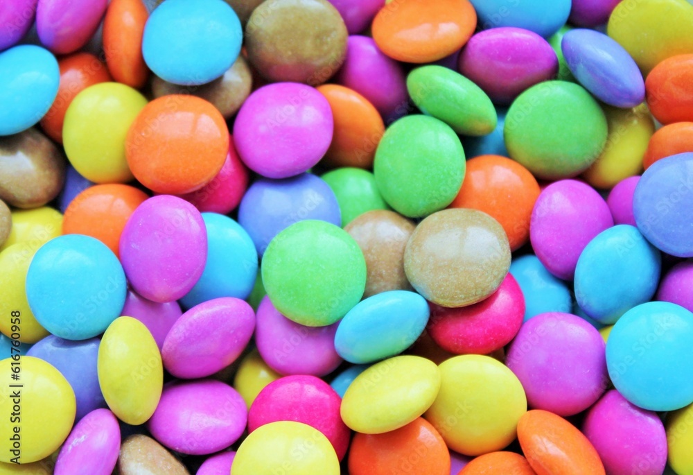 Multi colored candy coated chocolate button sprinkle texture - marties, sprinkles Multi colored candy coated chocolate button sprinkle texture - marties, sprinkles
