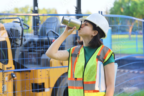 Outdoor builder woman portrait, construction worker