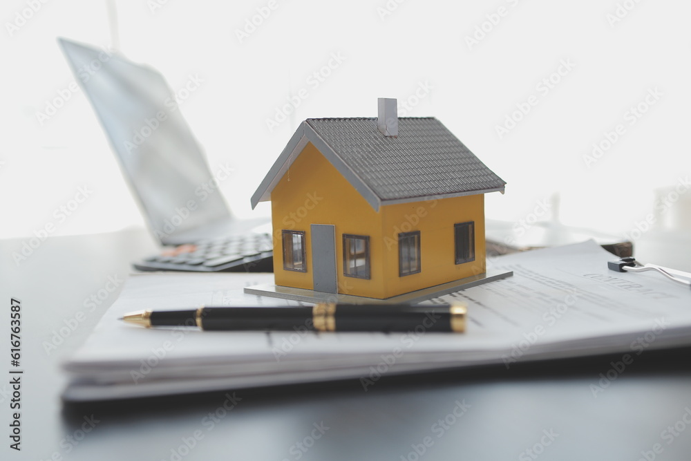 Real estate agent and customer signing contract to buy house, insurance or loan real estate.rent a house,get insurance or loan real estate or property. Real estate agent and customer signing contract to buy house, insurance or loan real estate.rent a house,get insurance or loan real estate or property.