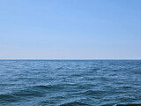 Small waves on Lake Michigan with afternoon cloudless sky