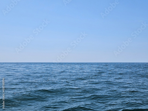 Small waves on Lake Michigan with afternoon cloudless sky