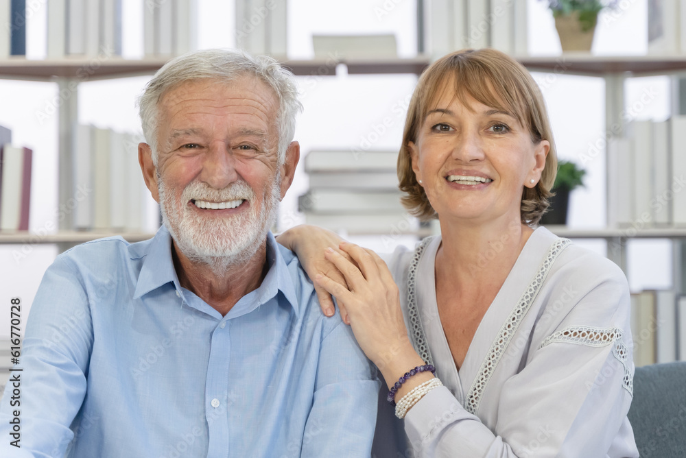 A simple day of a retired couple. Mature couple sitting in the living room A simple day of a retired couple. Mature couple sitting in the living room