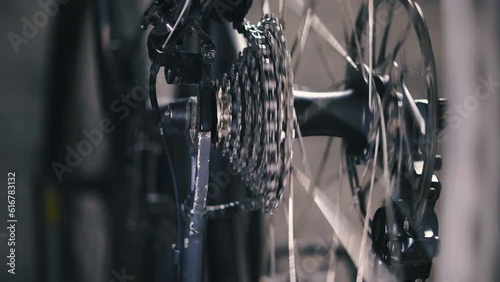Process of changing gears on the rear derailleur of a mountain bike. Close-up of the cassette and bike chain. Setting up and servicing your bike's driveline. Slow motion