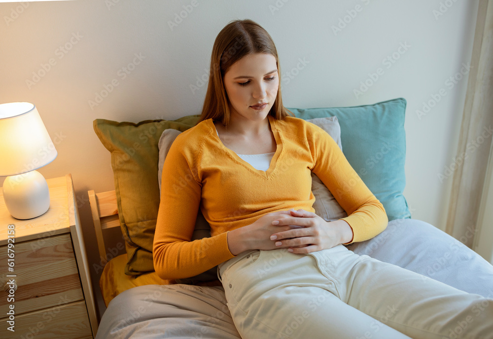 Young Blonde Lady Suffering From Menstrual Period Pain In Bedroom Young Blonde Lady Suffering From Menstrual Period Pain In Bedroom