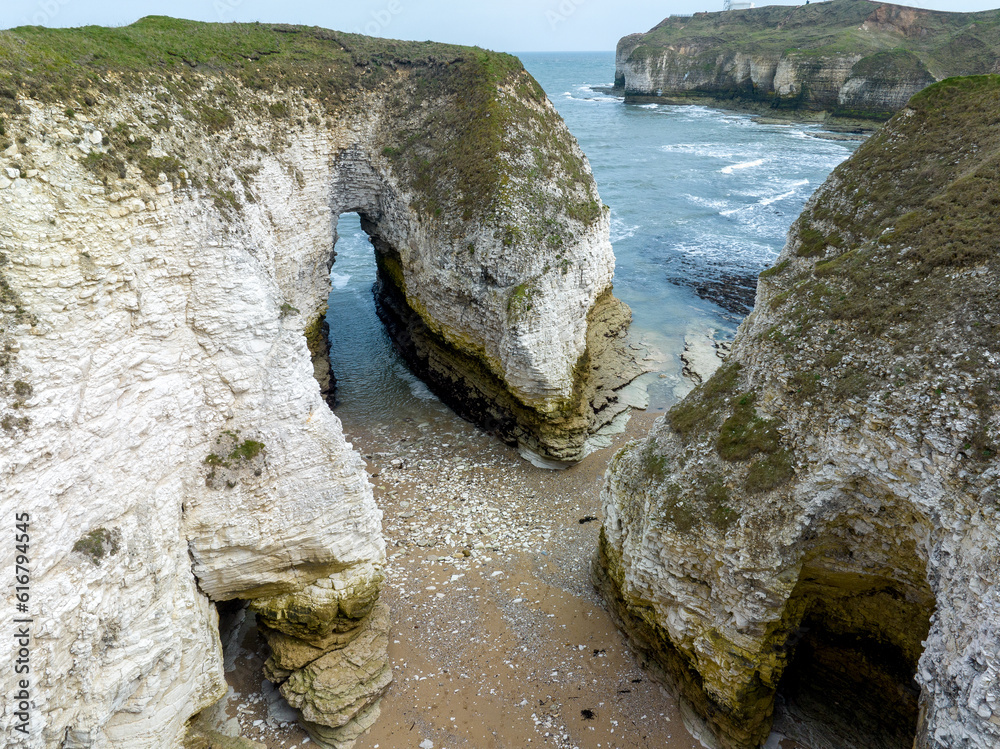 An aerial shot of the caves and white chalk cliffs near the North Yorkshire coast of North Landing near Flamborough.