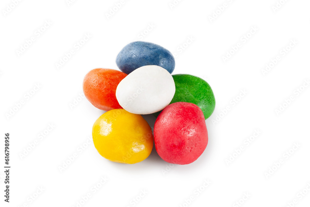Dragee candy. A pile of multi-colored dragee candies on a white background Dragee candy. A pile of multi-colored dragee candies on a white background