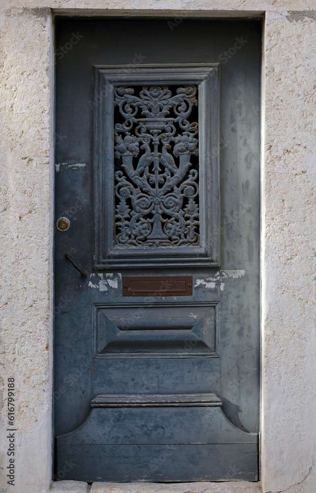 Old weathered door in Alfama, Lisbon, Portugal