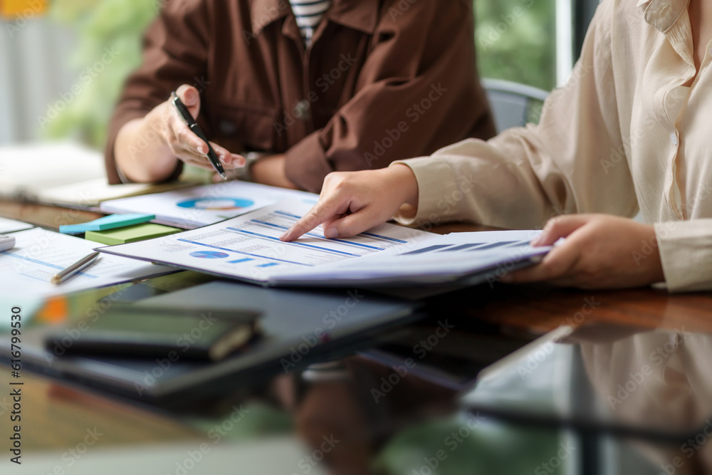 Business startup cooperation brainstorming on data documents in modern creative office.. Business startup cooperation brainstorming on data documents in modern creative office..