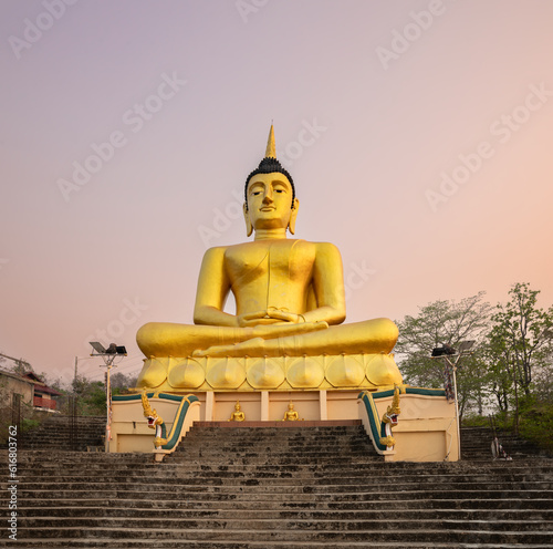 Golden Buddha overlooking Pakse at Wat Phousalao. Laos photo