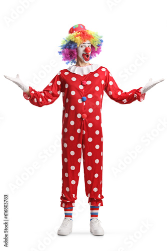Full length portrait of a clown gesturing welcome with hands