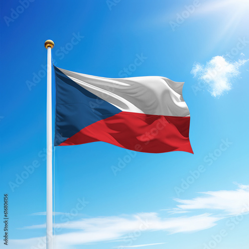Waving flag of Czechia on flagpole with sky background.