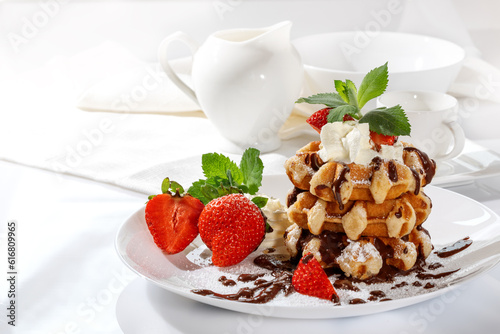 Belgian waffles with strawberries on a white background
