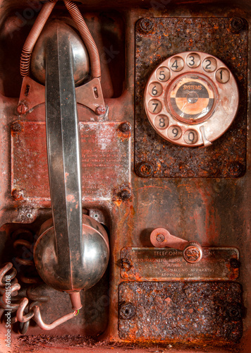 Vintage telephone in an abandoned mine buiilding photo