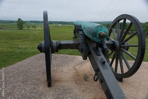10 pounder Parrott riffled cast iron artillery piece model 1861 at Gettysburg National Military Park, Pennsylvania. Battlefield in the background