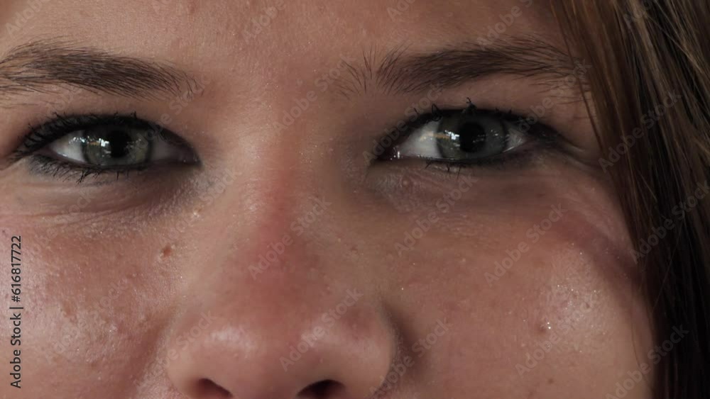 Female eyes and face close-up, girl opening beautiful eyes. Natural beauty of people. A beautiful woman with an attractive appearance. Video of a positive woman looking into the camera. Female eyes and face close-up, girl opening beautiful eyes. Natural beauty of people. A beautiful woman with an attractive appearance. Video of a positive woman looking into the camera.