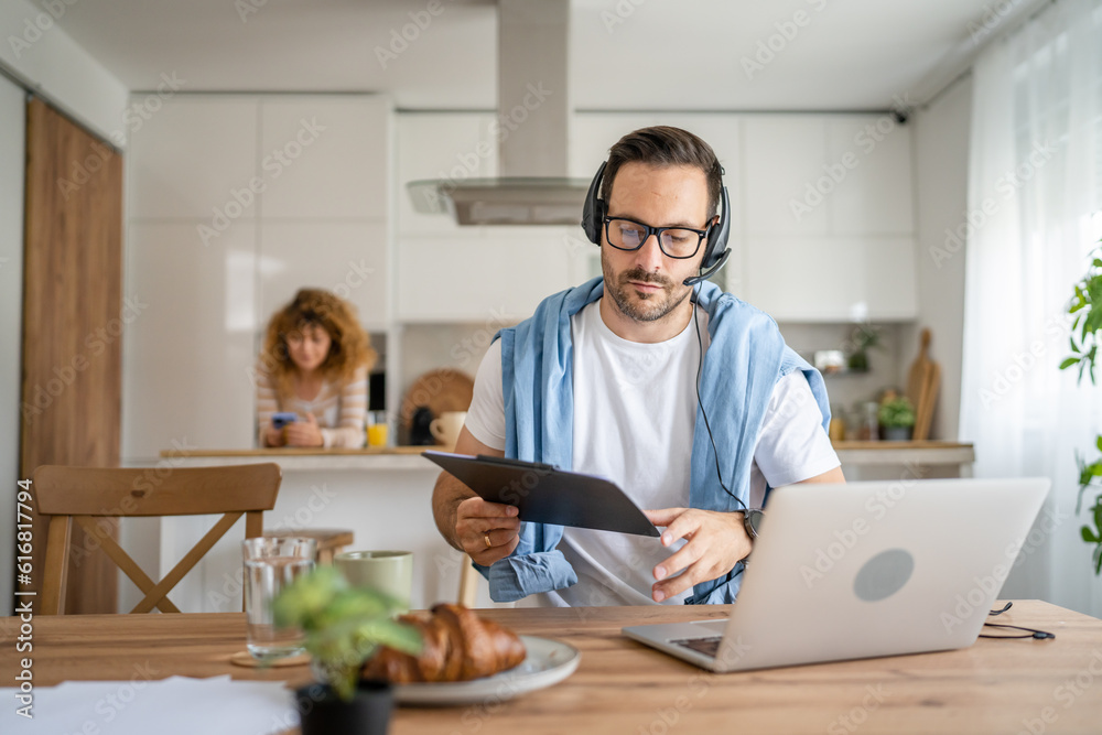 One man caucasian male freelancer work from home on laptop computer One man caucasian male freelancer work from home on laptop computer
