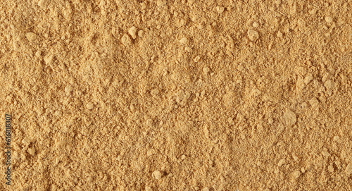 Ginger powder background and texture, top view 