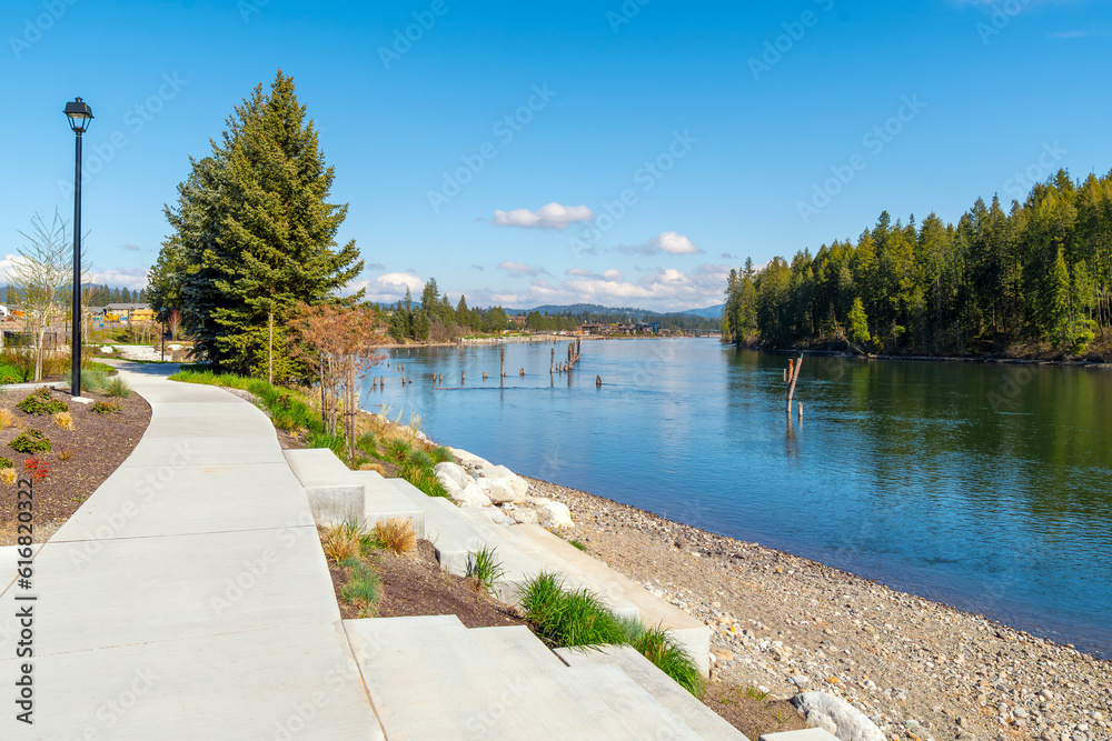 A small riverfront park and beach at a new home development along the Spokane River in the rural city of Coeur d'Alene, Idaho, USA, part of the North Idaho panhandle region.