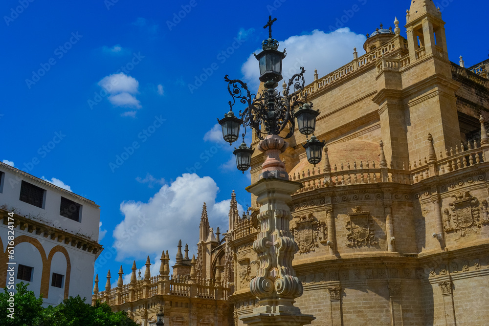'Cathedral de Sevilla' picture from the street. The cathedral, is open to public, you can see beautiful gothic style architecture unusually bright of the sunny weather