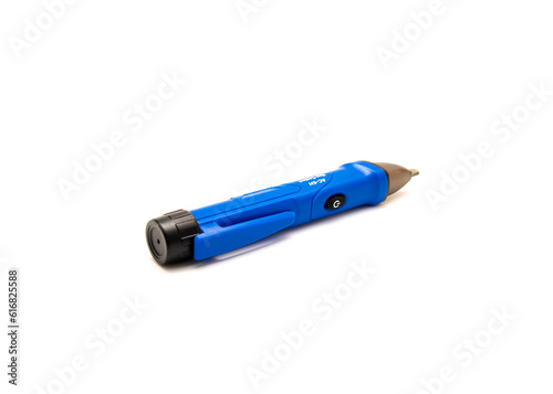 Side view non-contact voltage tester detector pen with power button isolated on white background, detect voltage in cable, outlet and wire photo