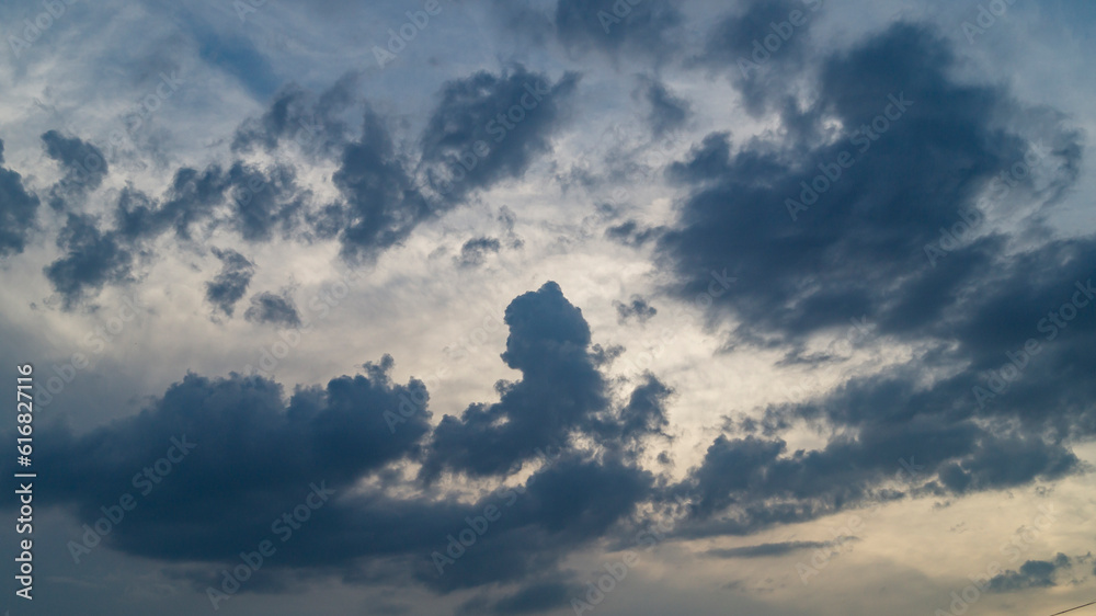 Dark clouds. Gray clouds in the evening. The sky is gray clouds. Black clouds at sunset