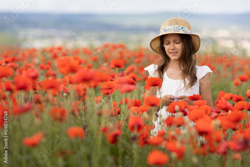 A girl in a poppy field