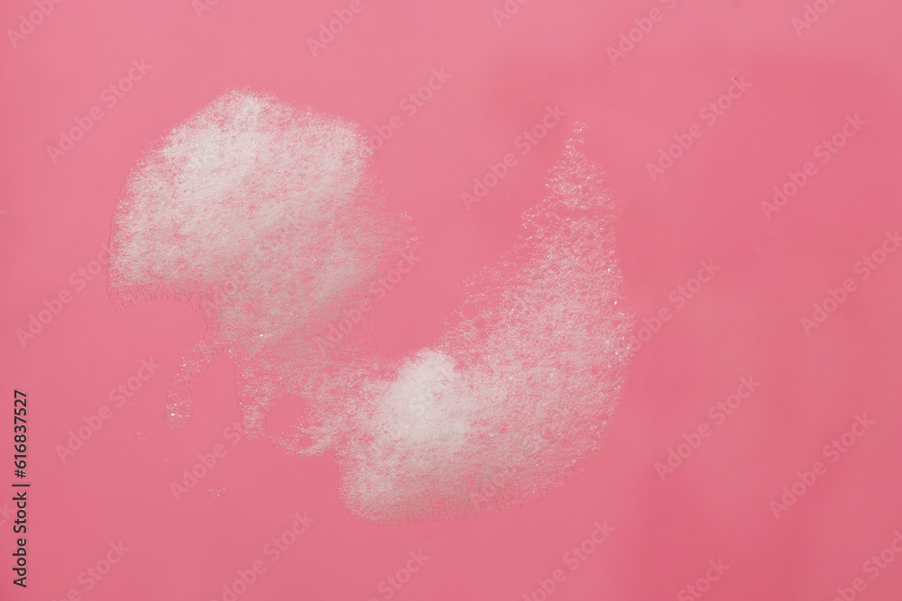 White foam bubble on pink background